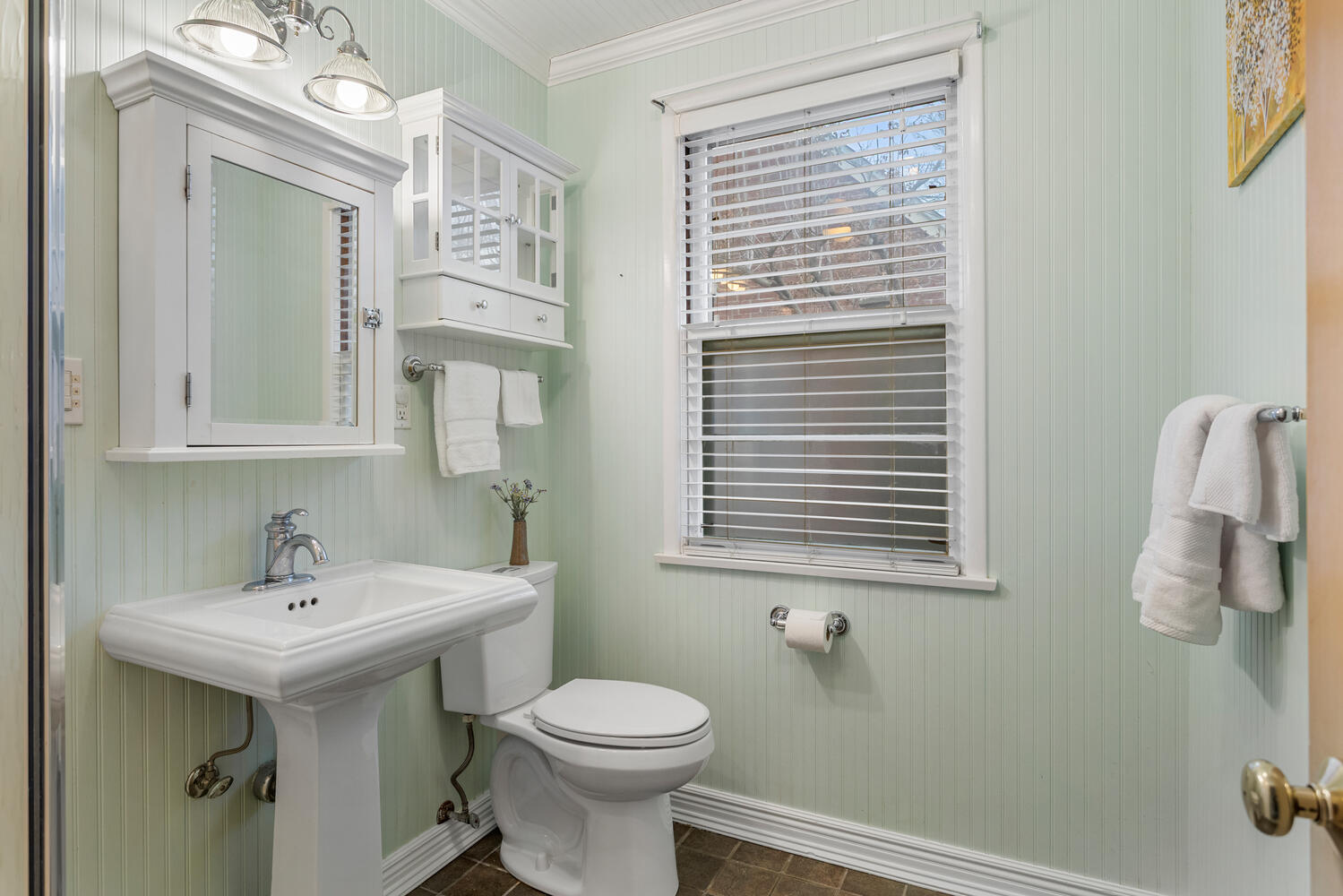 1111 West John Street Champaign, IL 61821 - Photo 18 of 39 a bathroom with a sink a mirror and a toilet