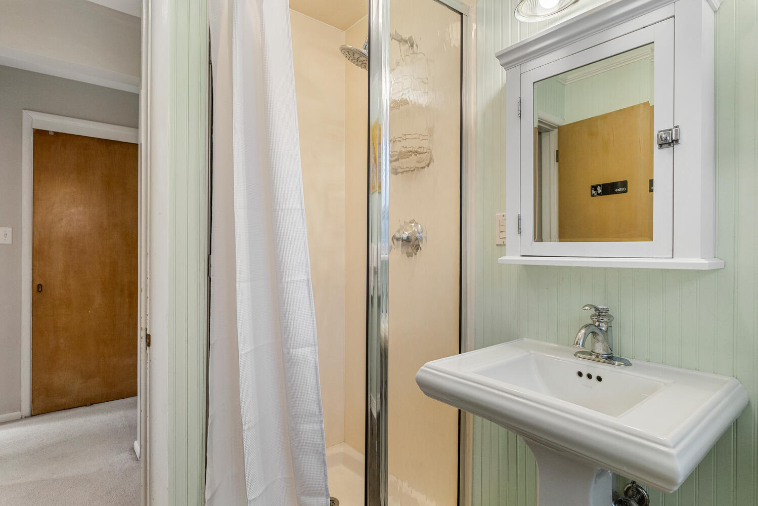 1111 West John Street Champaign, IL 61821 - Photo 19 of 39 a bathroom with a sink and a mirror