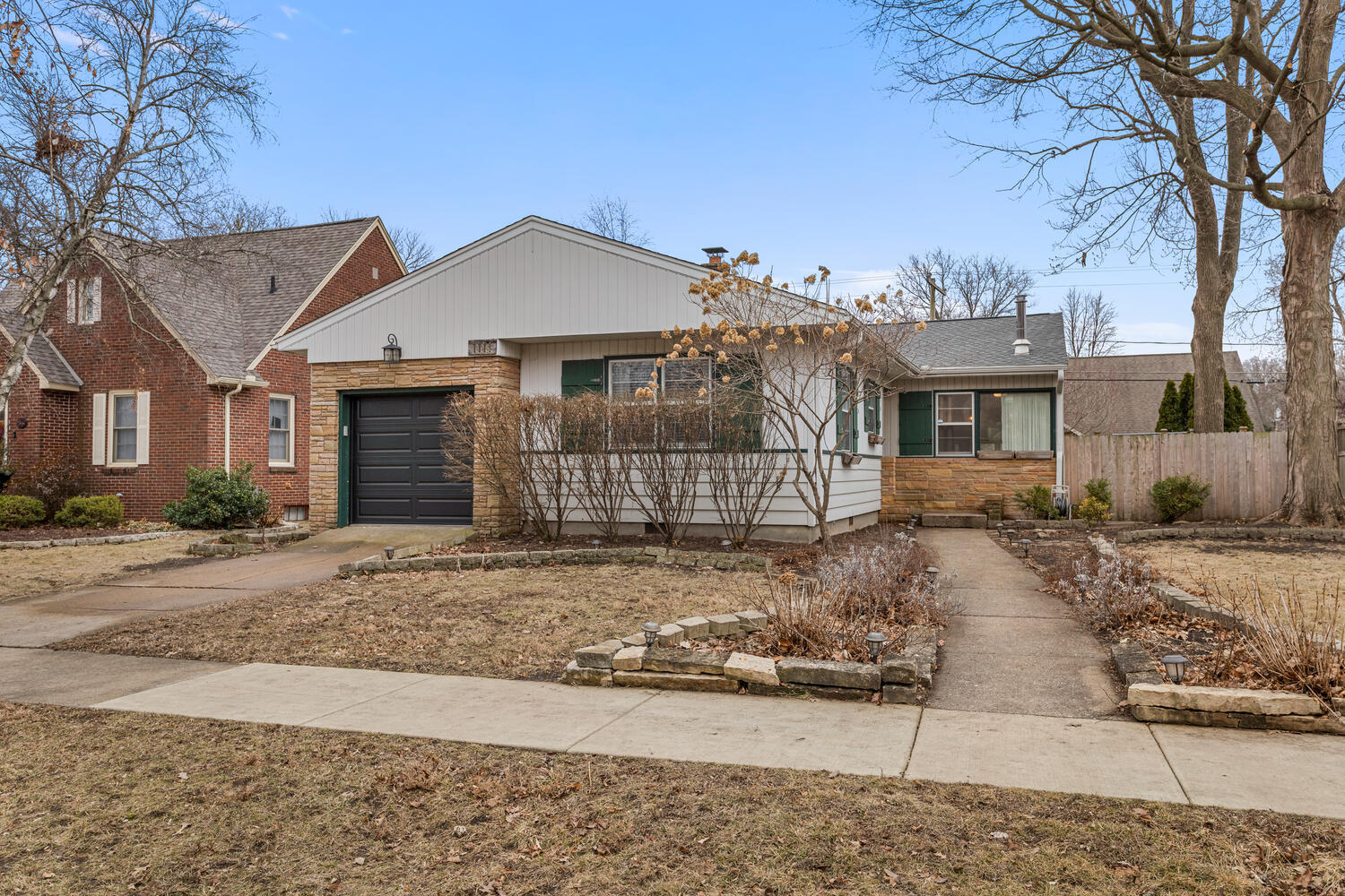 1111 West John Street Champaign, IL 61821 - Photo 2 of 39 a front view of a house with a yard