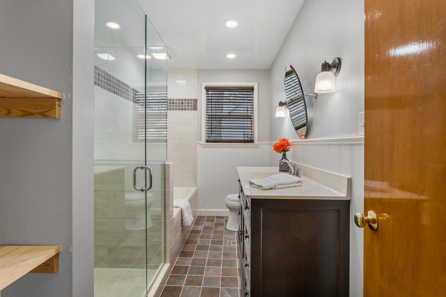 1111 West John Street Champaign, IL 61821 - Photo 24 of 39 a bathroom with a sink shower and a mirror