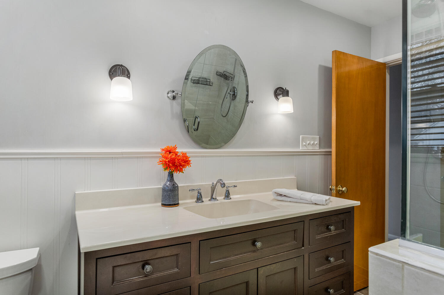 1111 West John Street Champaign, IL 61821 - Photo 25 of 39 a bathroom with a sink and a mirror