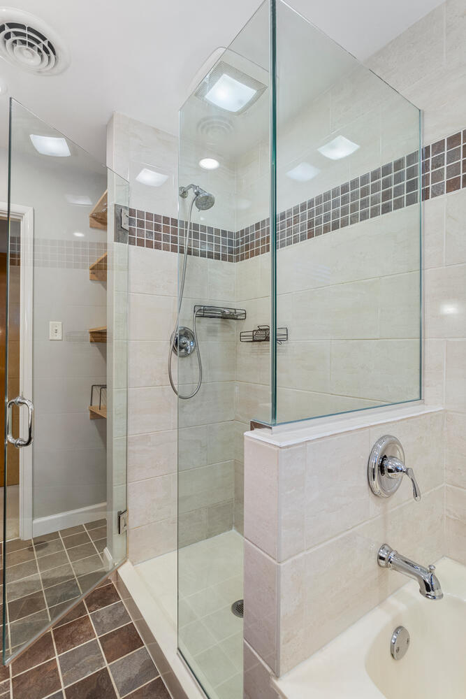 1111 West John Street Champaign, IL 61821 - Photo 26 of 39 a bathroom with a shower and a sink