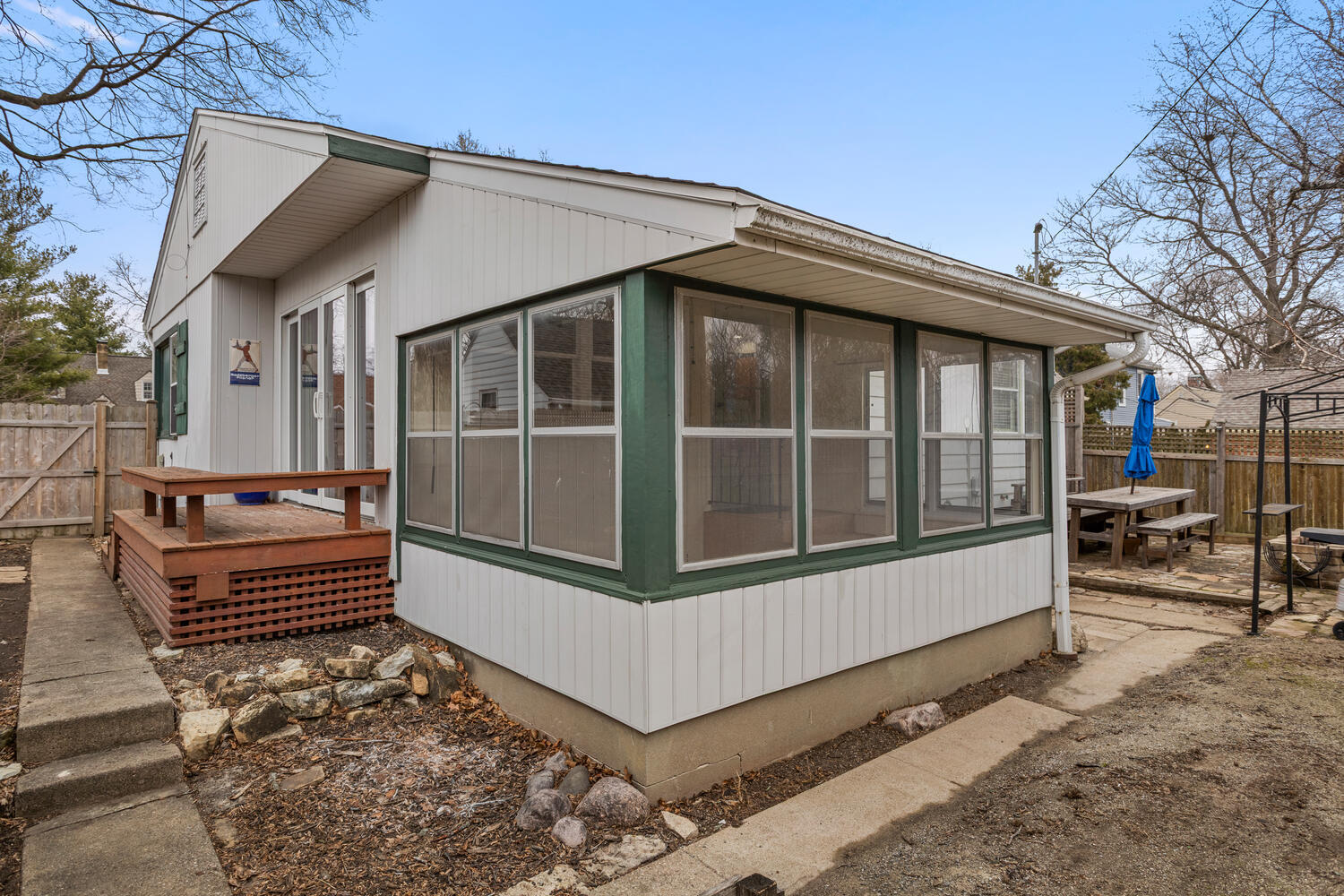 1111 West John Street Champaign, IL 61821 - Photo 34 of 39 a view of wooden house with a large window and wooden fence