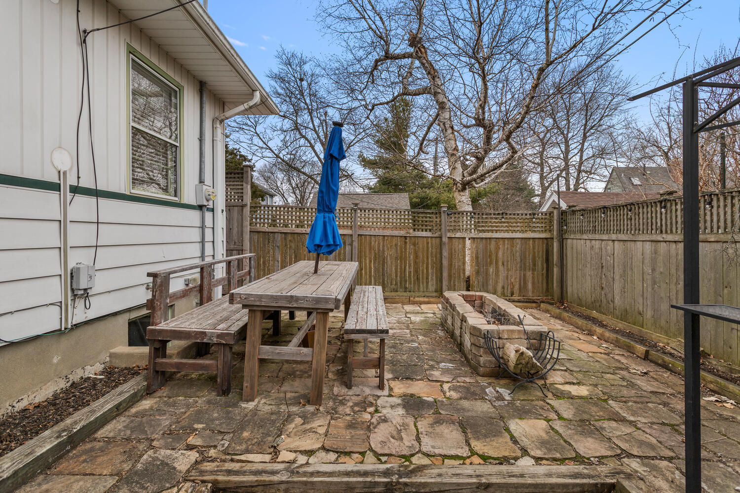 1111 West John Street Champaign, IL 61821 - Photo 35 of 39 a view of a patio with table and chairs and wooden fence