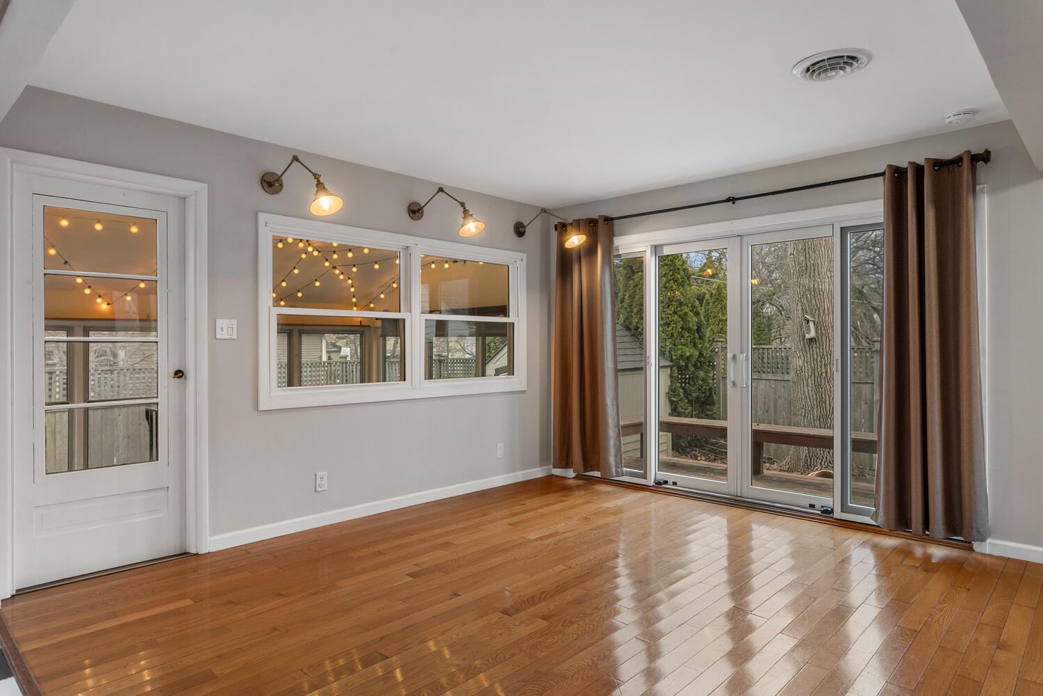 1111 West John Street Champaign, IL 61821 - Photo 8 of 39 a view of an empty room with window and doors