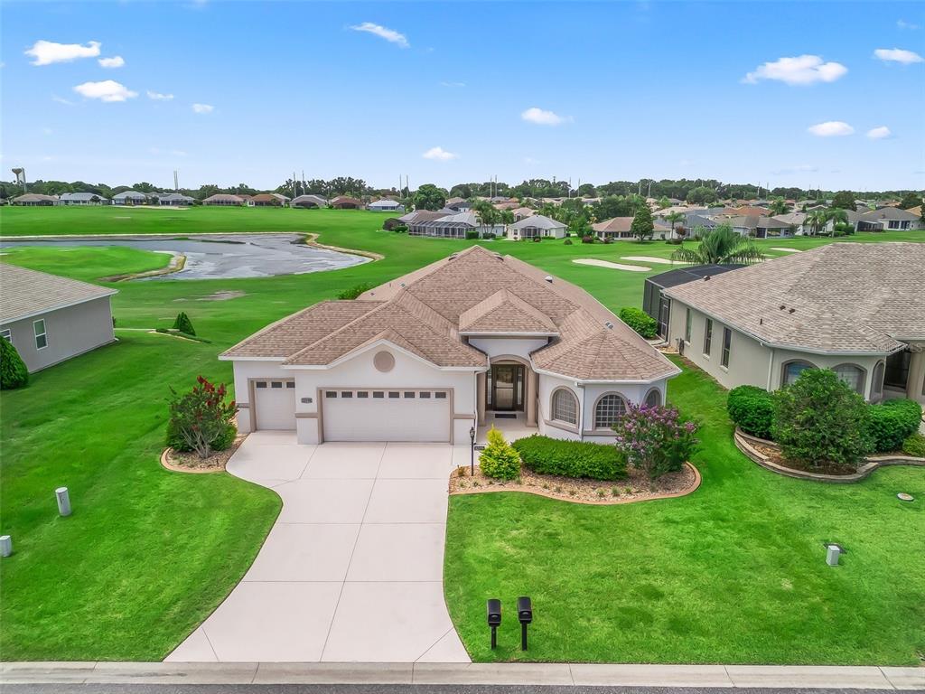 12198 Southeast 176th Loop Summerfield, FL 34491 - Photo 1 of 1 a front view of a house with garden