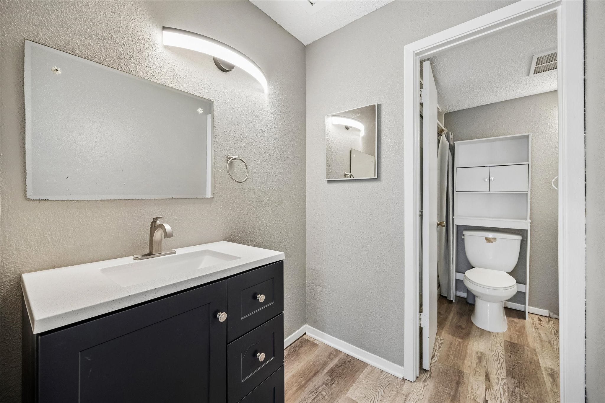 2018 West Rundberg Lane, Unit 13A Austin, TX 78758 - Photo 11 of 11 a bathroom with a sink toilet and a mirror