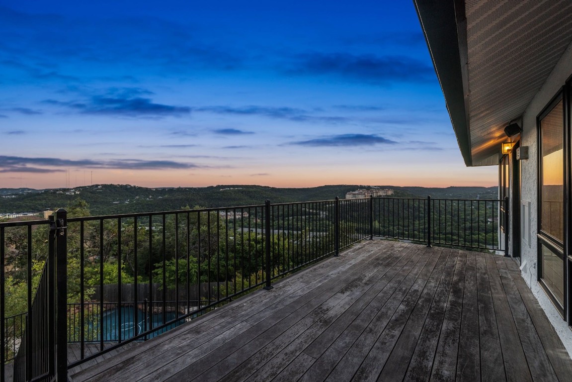 a view of balcony with wooden floor