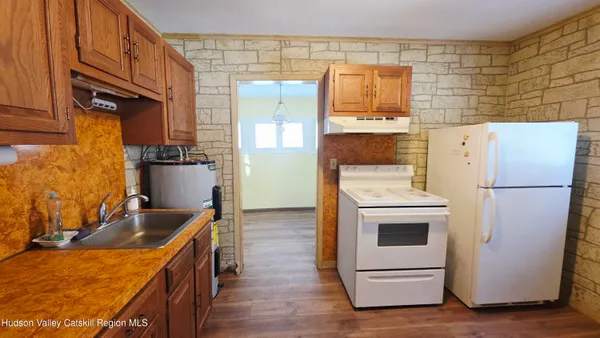 a bathroom with a sink a washer and dryer