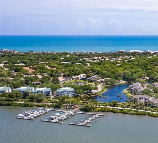 an aerial view of a houses with a yard