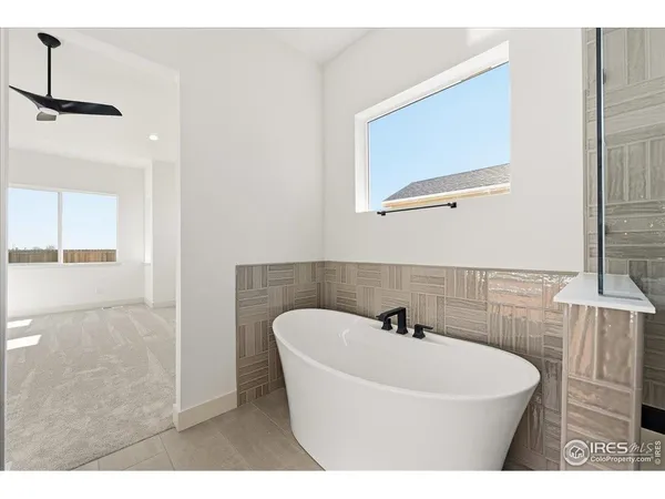 a bathroom with a sink a mirror and a bathtub