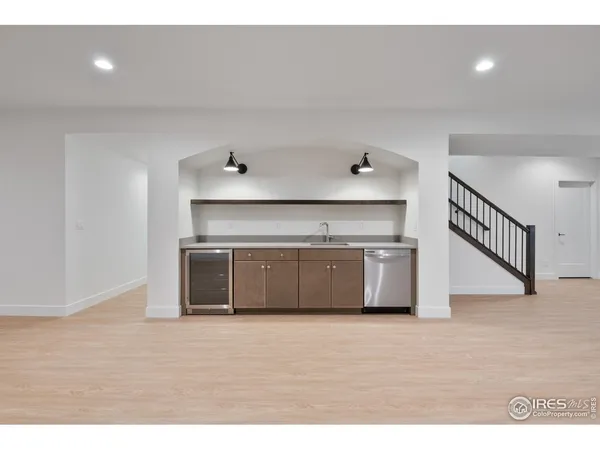 a kitchen with stainless steel appliances a microwave and a counter top
