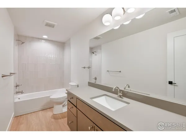 a bathroom with a sink a toilet and a bathtub