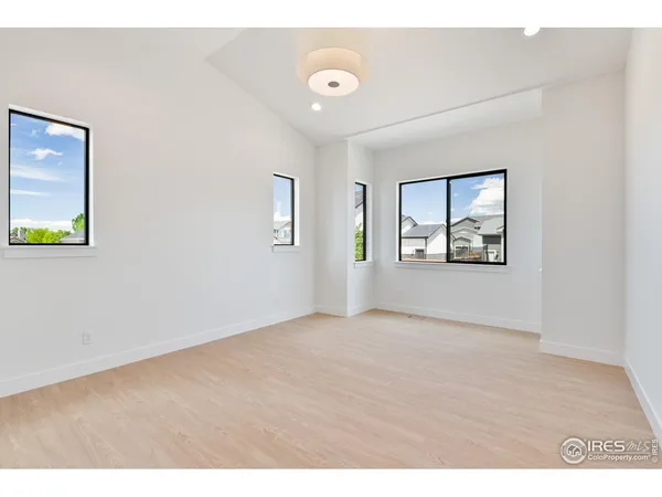 a view of an empty room with windows