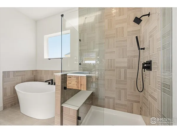 a bathroom with a shower a mirror a sink and a shower