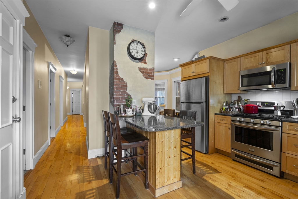 733 East 3rd Street Boston, MA 02127 - Photo 3 of 12 a kitchen with a sink appliances and cabinets