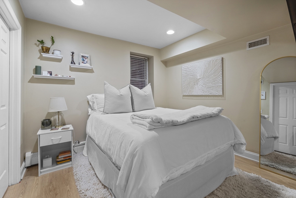 733 East 3rd Street Boston, MA 02127 - Photo 4 of 12 a bedroom with a bed and a couch