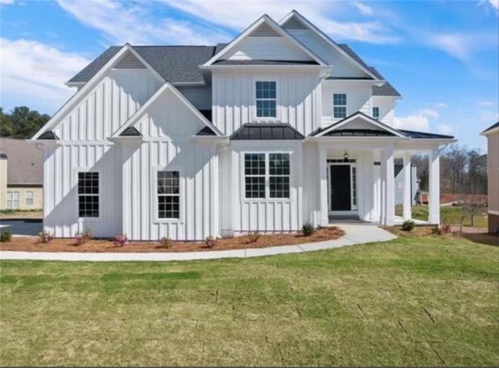 3338 Lakeview Parkway Villa Rica, GA 30180 - Photo 2 of 2 a front view of a house with a yard