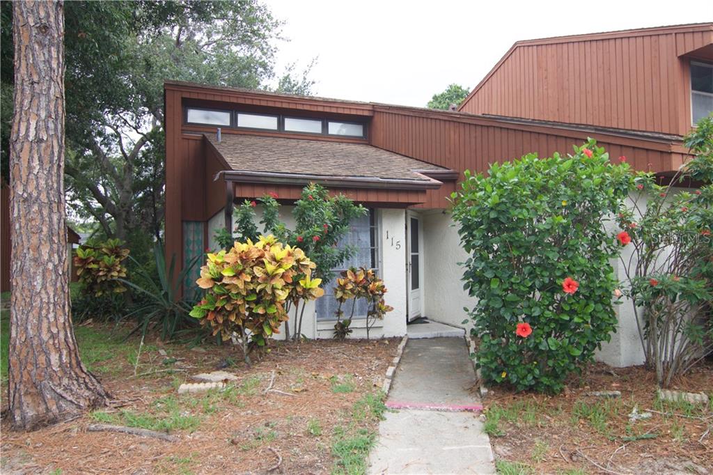 2070 Sunset Point Road, Unit 115 Clearwater, FL 33765 - Photo 1 of 1 a front view of a house