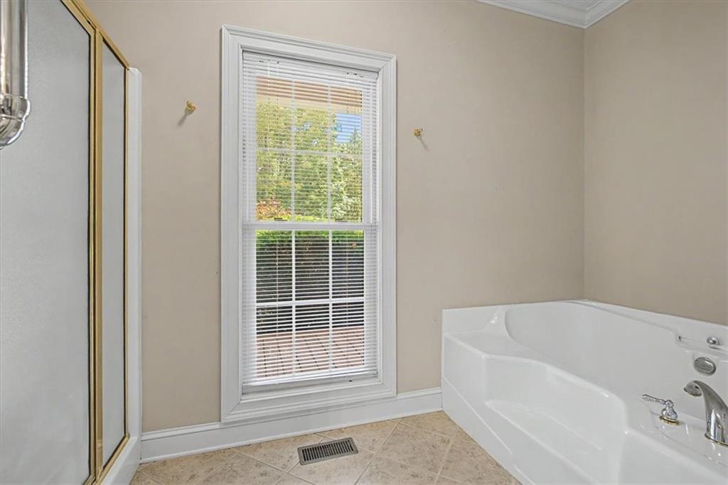 1136 Cole Lake Road Dallas, GA 30157 - Photo 33 of 72 a white bath tub sitting next to a window