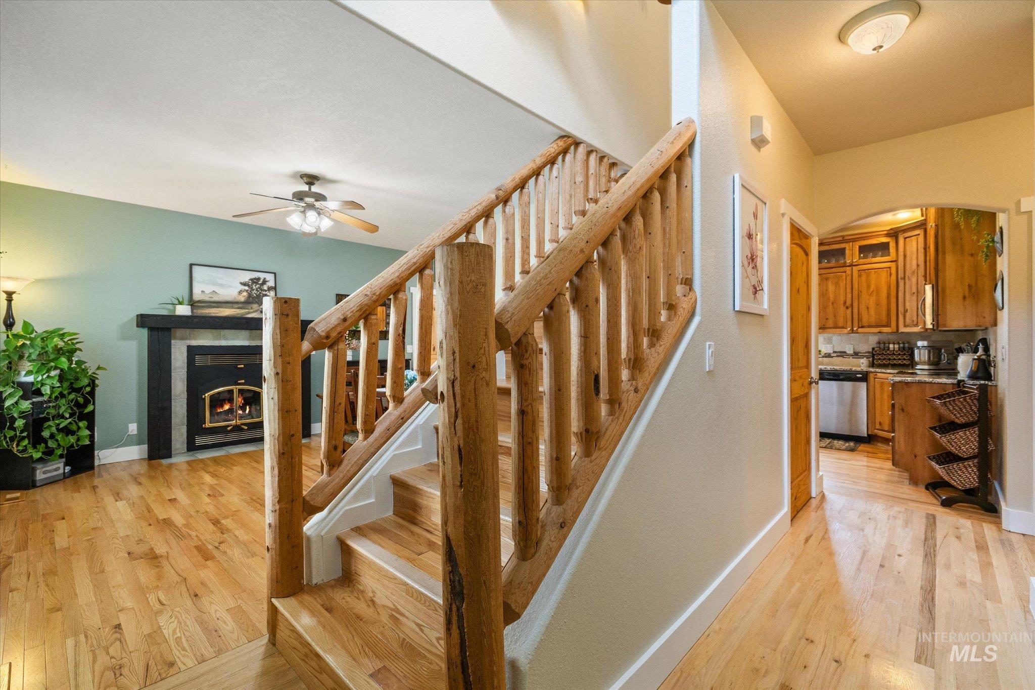 1140 Edgemont Road Emmett, ID 83617 - Photo 14 of 50 Wood-finish flooring throughout, featuring a rustic wood staircase with balusters and handrail