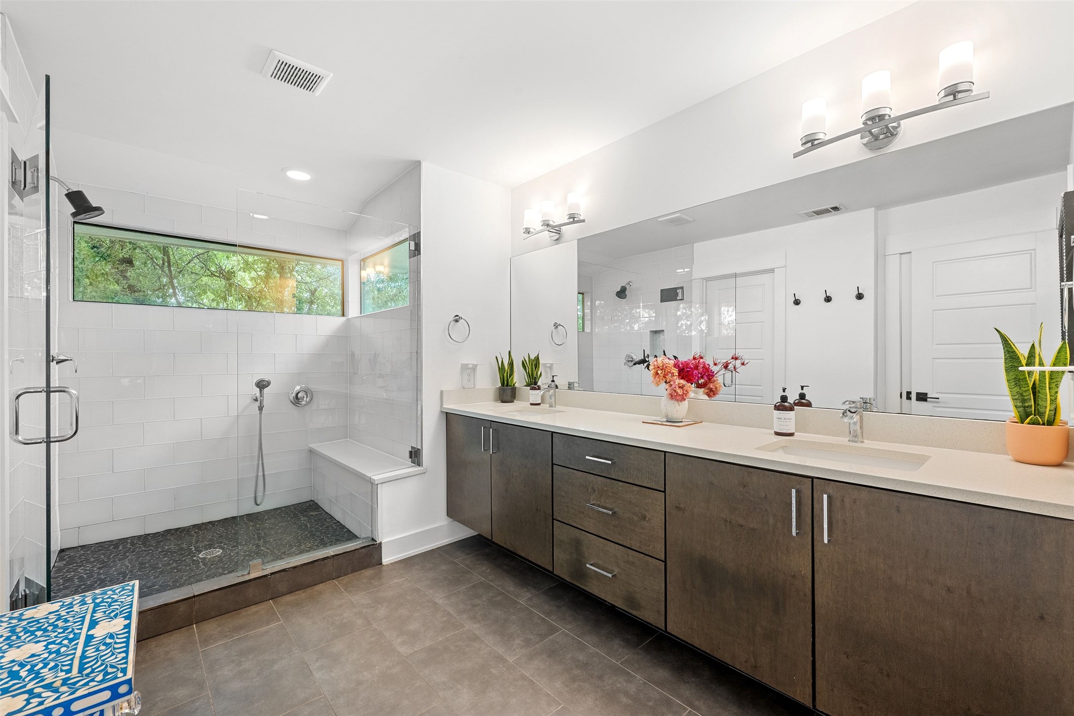 4615 Depew Avenue Austin, TX 78751 - Photo 22 of 40 Huge main bathroom with storage, double vanities, and walk-in shower