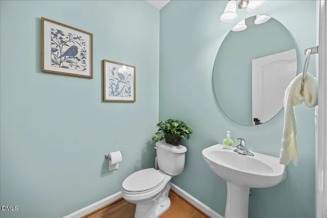 a view of a kitchen with refrigerator and window