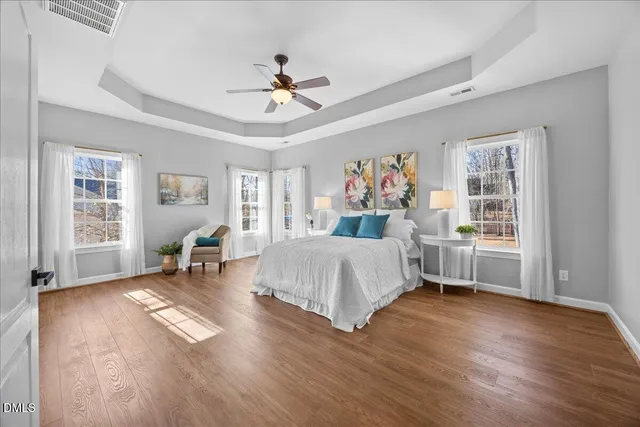 a living room with a bed furniture and a window