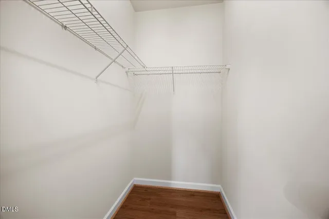 a view of a wooden deck with a yard