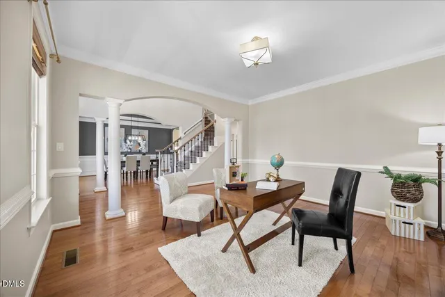 a view of a dining room with furniture window and wooden floor
