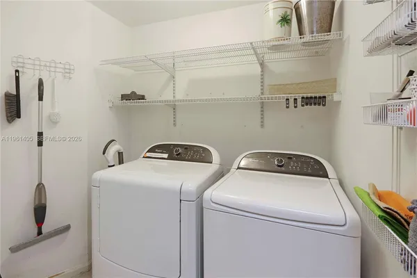a utility room with dryer and washer
