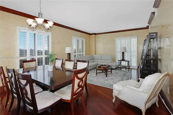 a view of a dining room with furniture window and wooden floor