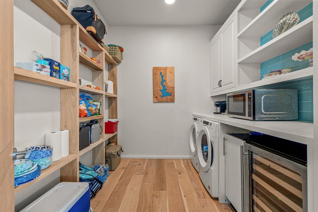 7145 Hickey Road Azle, TX 76020 - Photo 16 of 40 a storage room with washer and dryer