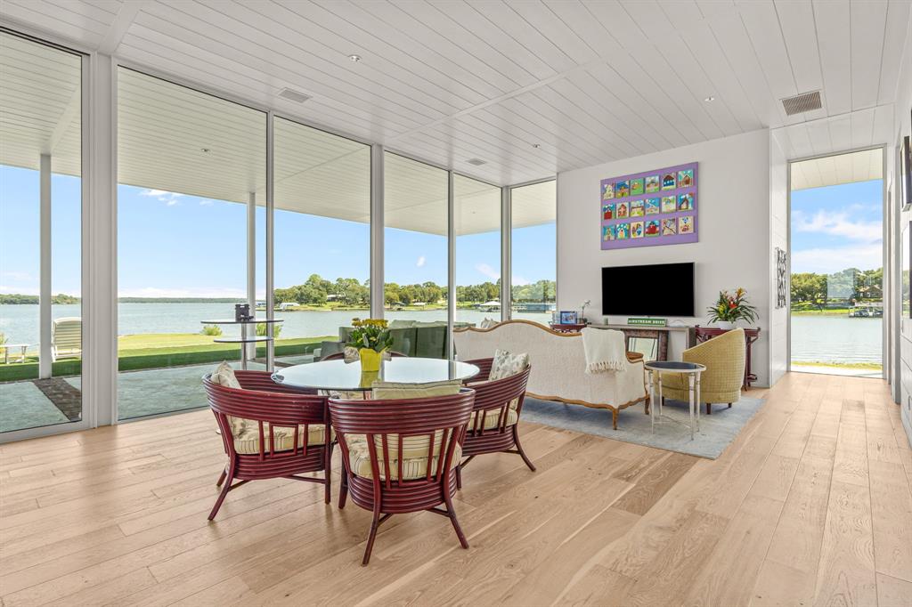 7145 Hickey Road Azle, TX 76020 - Photo 17 of 40 a view of a dining room with furniture window and wooden floor