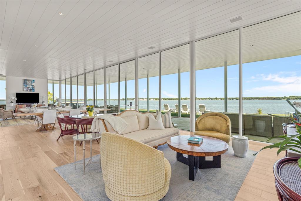 7145 Hickey Road Azle, TX 76020 - Photo 19 of 40 a living room with furniture and a floor to ceiling window
