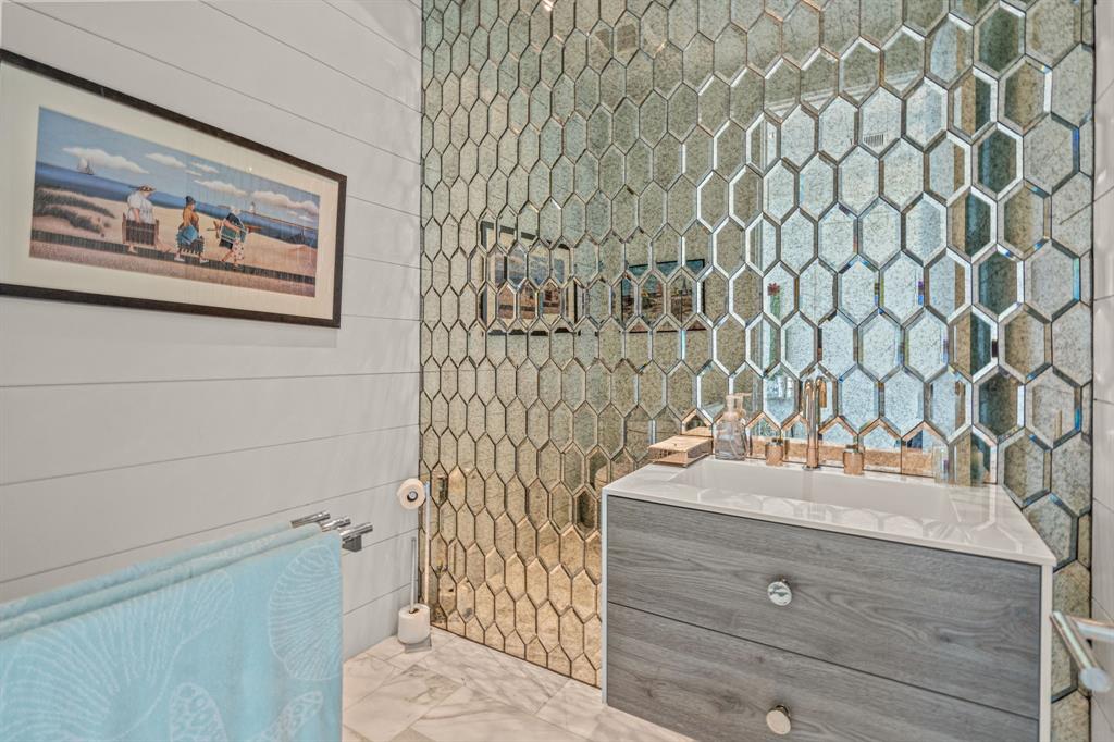 7145 Hickey Road Azle, TX 76020 - Photo 20 of 40 a bathroom with a sink and a mirror