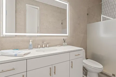 a bedroom with a bed and a couch