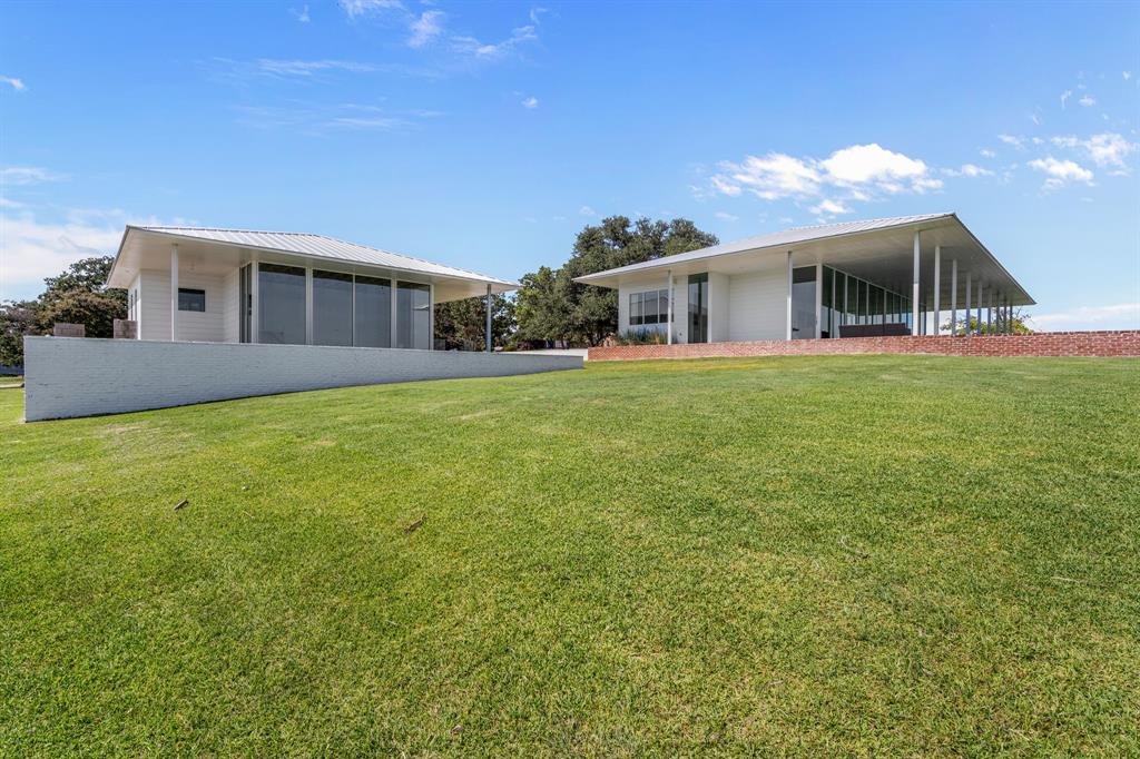 7145 Hickey Road Azle, TX 76020 - Photo 27 of 40 a front view of a house with a garden