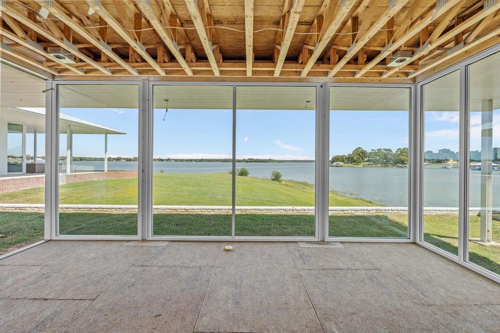 7145 Hickey Road Azle, TX 76020 - Photo 31 of 40 a view of an empty room with a sliding door