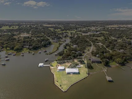 an aerial view of a house with a lake view