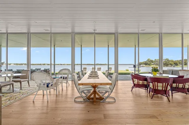a view of a dining room with furniture window and outside view