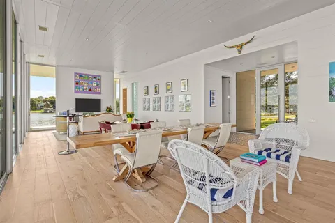 a living room with fireplace furniture and a flat screen tv
