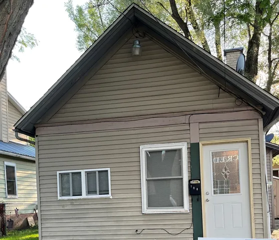 a front view of a house with a garage