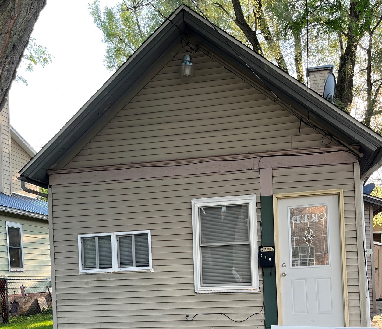 a front view of a house with a garage
