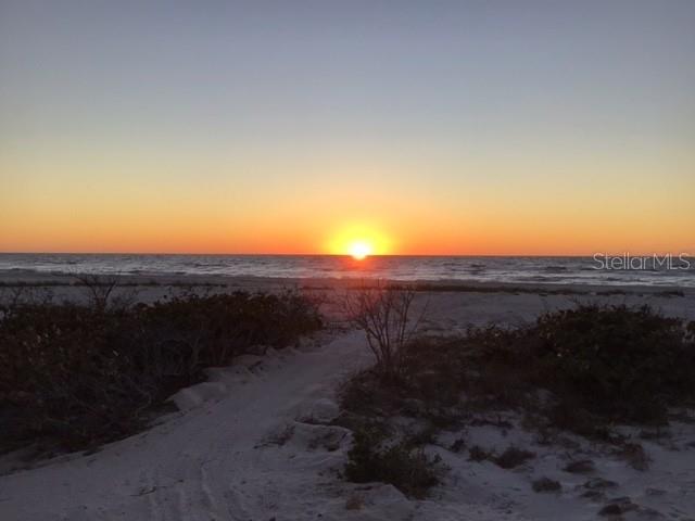 420 Gulf Boulevard, Unit 6 Boca Grande, FL 33921 - Photo 1 of 26 a view of a dry yard with wooden fence
