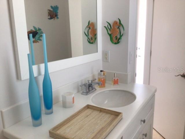 420 Gulf Boulevard, Unit 6 Boca Grande, FL 33921 - Photo 16 of 26 a bathroom with a sink and a window