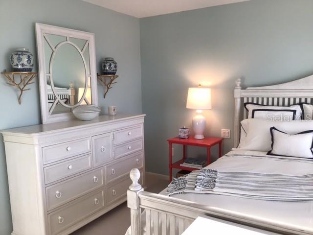 420 Gulf Boulevard, Unit 6 Boca Grande, FL 33921 - Photo 22 of 26 a bedroom with a bed and a dresser