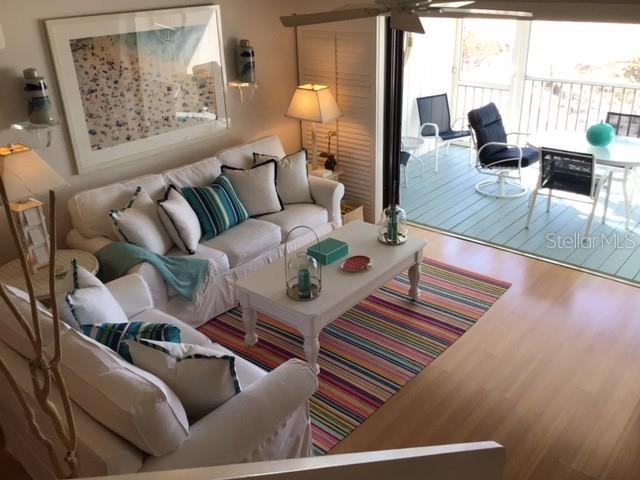 420 Gulf Boulevard, Unit 6 Boca Grande, FL 33921 - Photo 5 of 26 a living room with furniture and wooden floor
