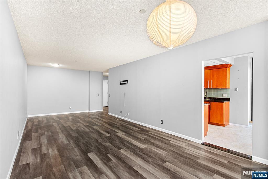 800 Palisade Avenue, Unit 2007 Fort Lee, NJ 07024 - Photo 11 of 21 an empty room with a mirror and a window