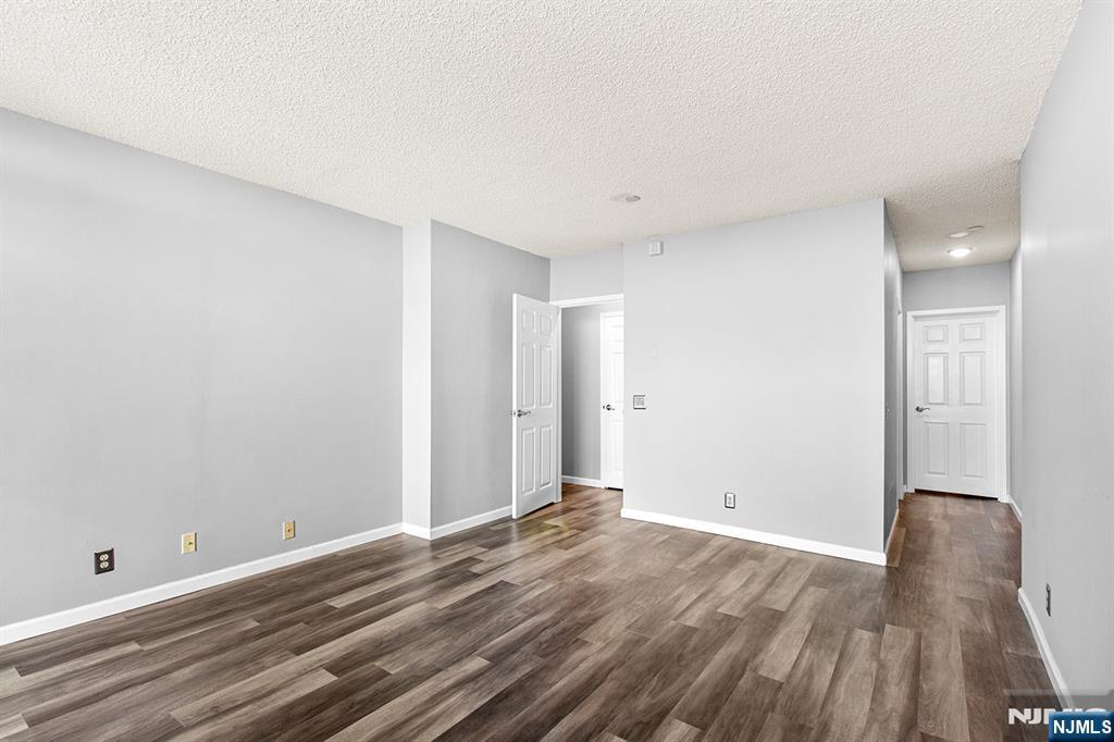 800 Palisade Avenue, Unit 2007 Fort Lee, NJ 07024 - Photo 16 of 21 a view of room with wooden floor